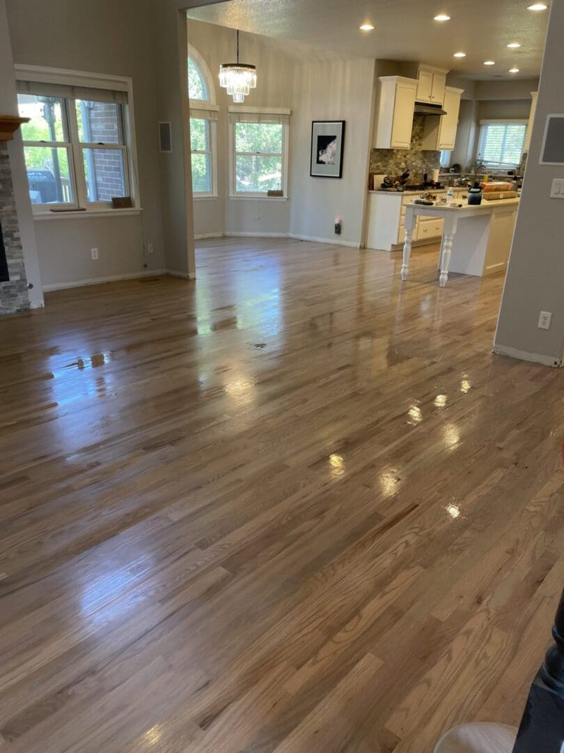 Spacious living area with wooden flooring.