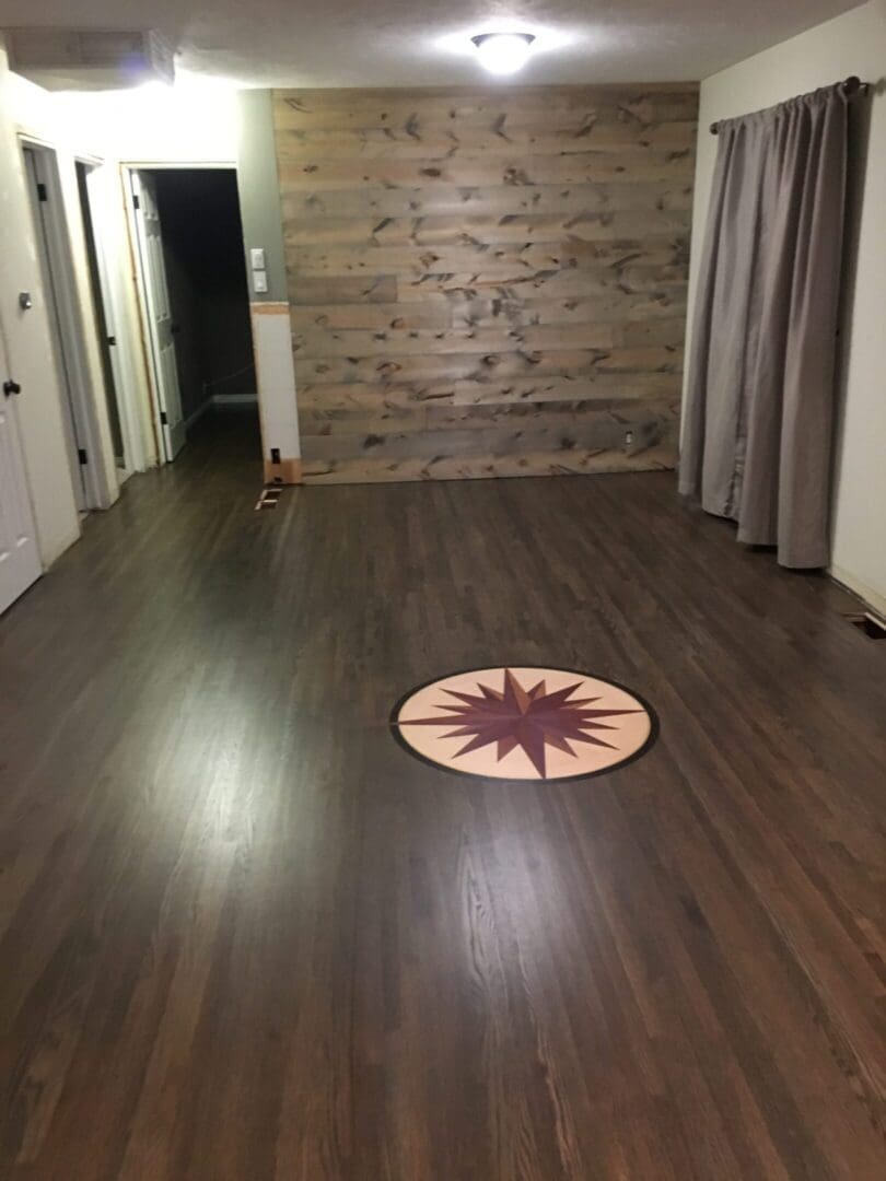 Empty room with wooden floor and wall.