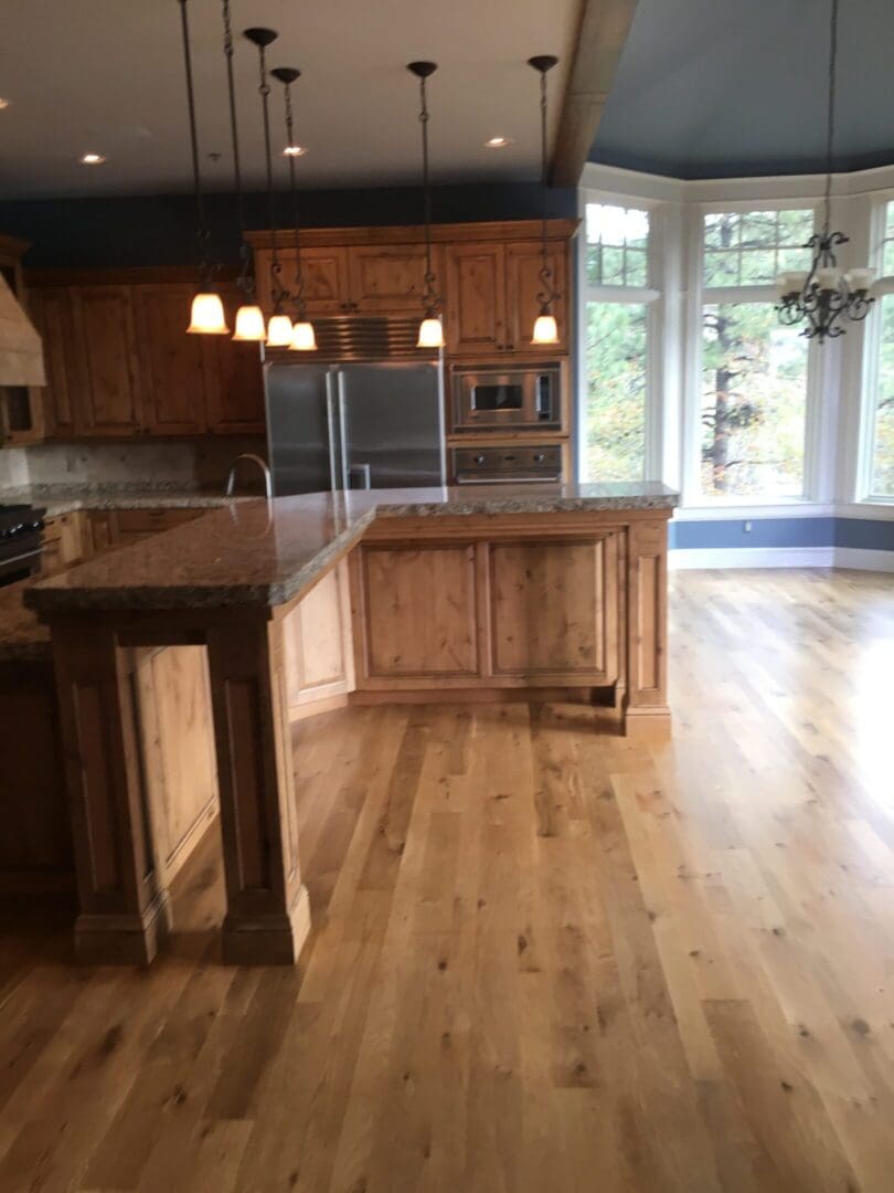 Spacious kitchen with wooden cabinets and island.
